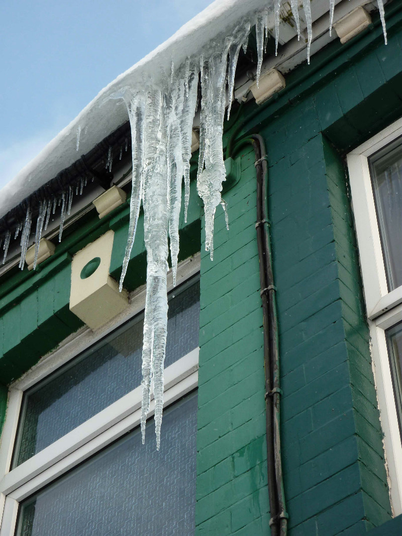 Icicles hanging from our house, 2011