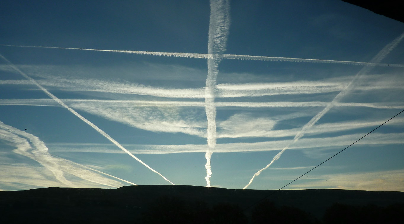 con trails over Mynydd Carn-y Cefn